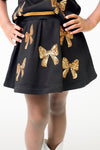 Belle Cher Black and Gold Bows Skort