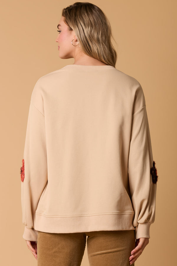 LONG SLEEVE SWEATSHIRT W/FLOWER EMBELLISHMENT