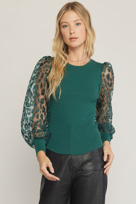 Solid round neck long sleeve top featuring sheer animal print sleeves