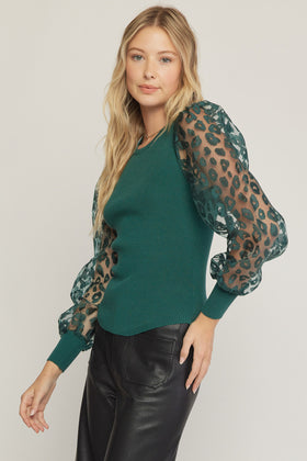 Solid round neck long sleeve top featuring sheer animal print sleeves